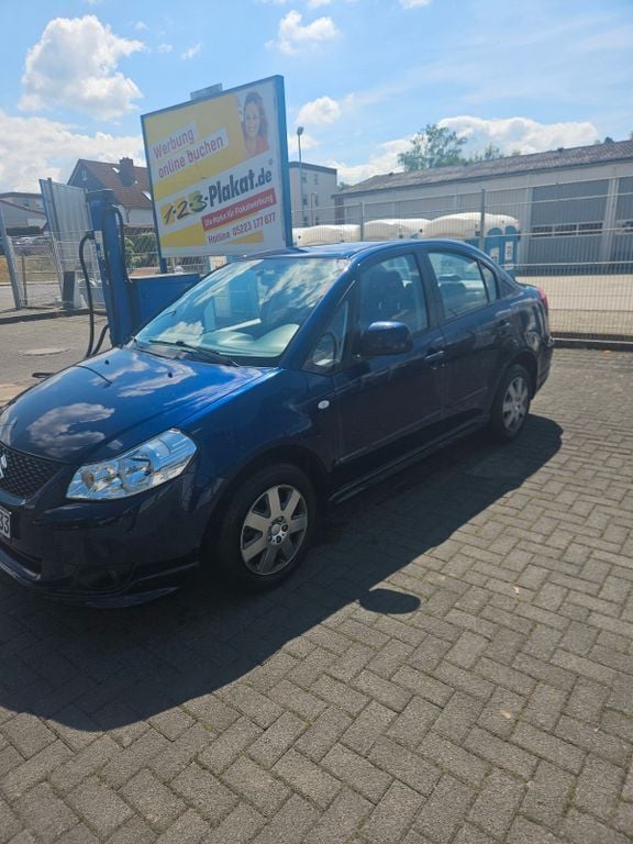 Blau Gebraucht 2009 Suzuki SX4 Limousine | 4.499 € (Guter Preis) - Bild 1/4