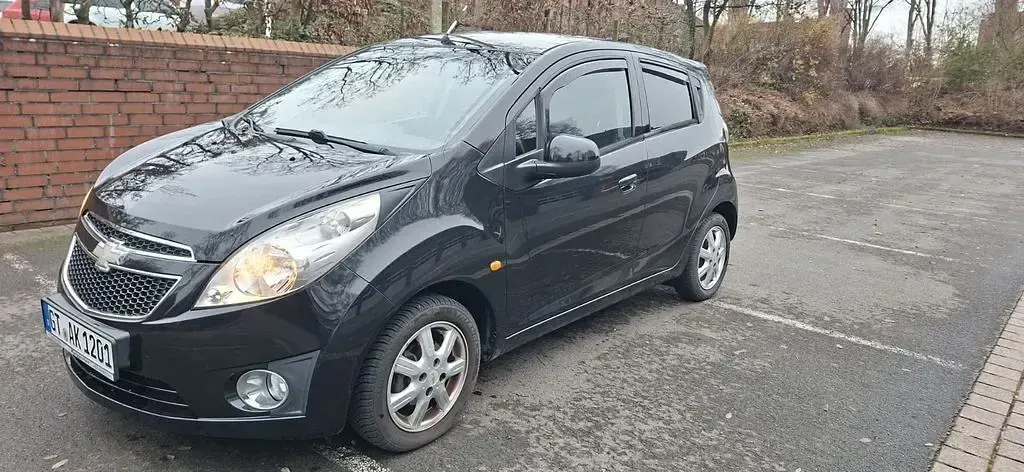Gebraucht Chevrolet Spark 94 PS (69 kW) 2011 Schwarz Kleinwagen