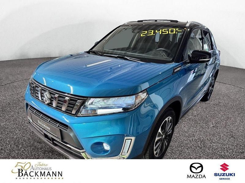 Grün Gebraucht 2022 Suzuki Vitara Comfort+ SUV | 21.950 € (Fairer Preis) - Bild 1/3