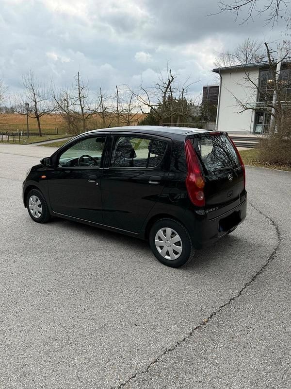 Gebraucht Daihatsu Cuore 69 PS (50 kW) 2008 Schwarz Kleinwagen