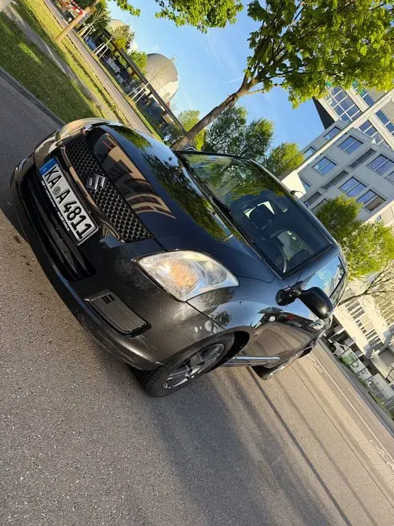 Usado Suzuki Swift 93 CV (68 kW) 2010 Negro Utilitario