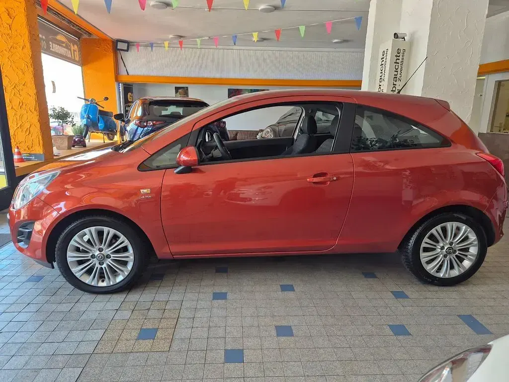 Gebraucht Opel Corsa Active 87 PS (63 kW) 2013 Orange Kleinwagen