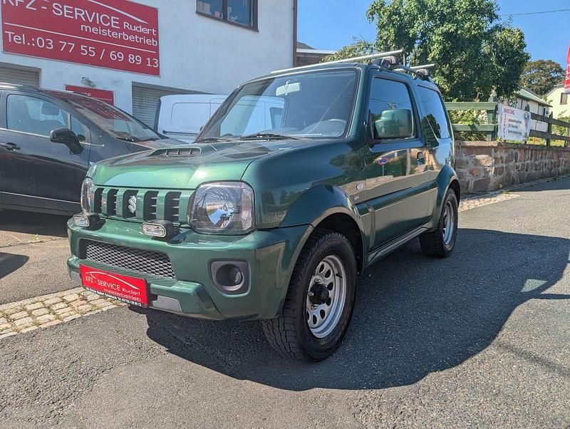 Grün Gebraucht 2014 Suzuki Jimny Ranger Comfort SUV | 13.788 € (Fairer Preis) - Bild 1/4
