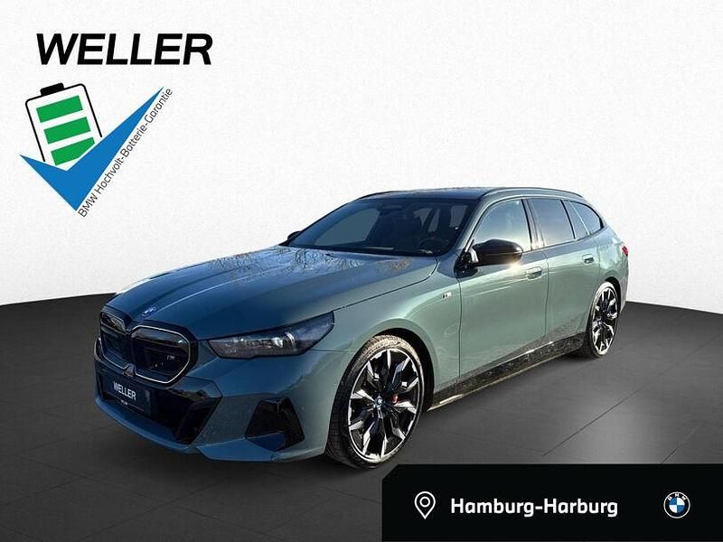 Grün Gebraucht 2024 BMW i5 Comfort Edition Kombi | 73.950 € - Bild 1/3
