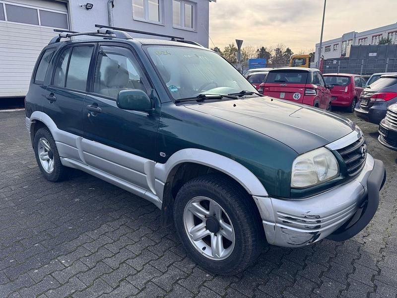 Grün Gebraucht 2000 Suzuki Grand Vitara Comfort SUV | 5.999 € - Bild 1/4