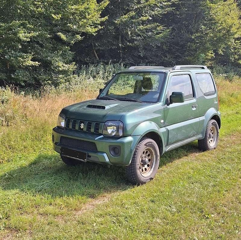 Grün Gebraucht 2013 Suzuki Jimny Style SUV | 7.000 € (Superpreis) - Bild 1/3