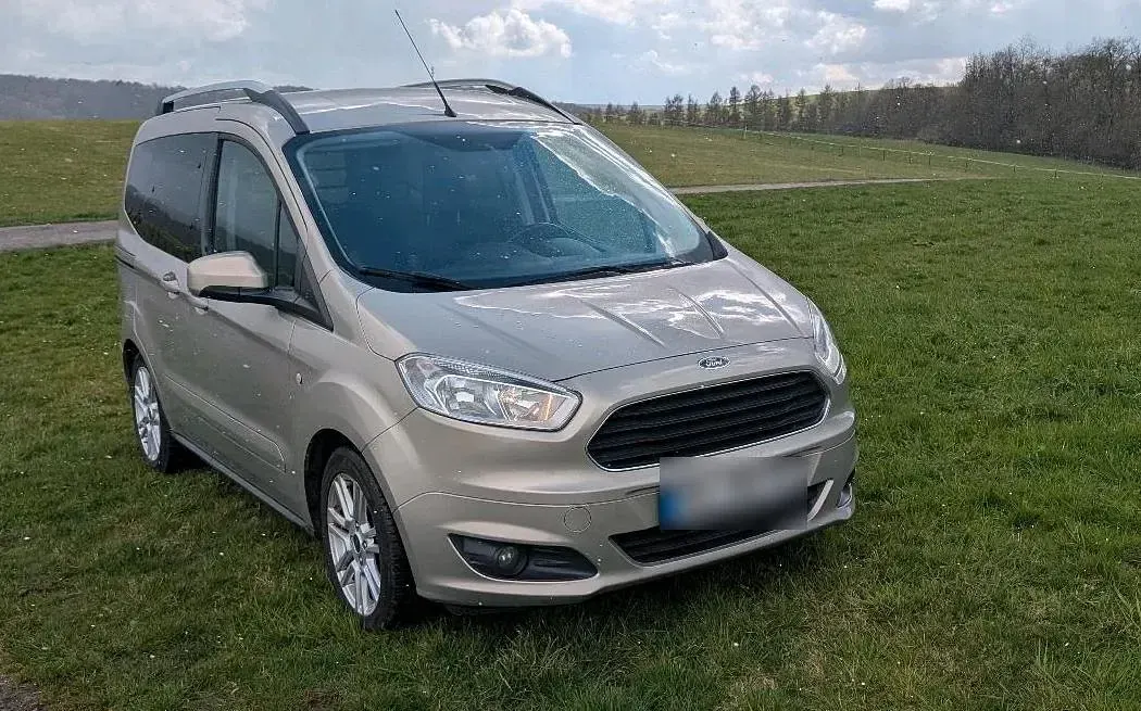 Gebraucht Ford Tourneo Courier 101 PS (74 kW) 2018 Silber Van / Kleinbus