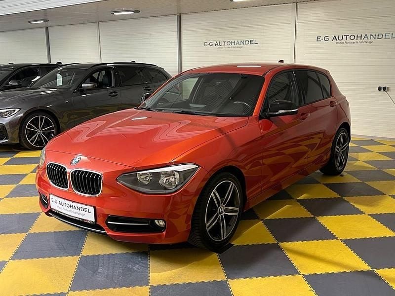 Orange Gebraucht 2013 BMW 116 Sport Line Kleinwagen | 9.590 € (Fairer Preis) - Bild 1/4