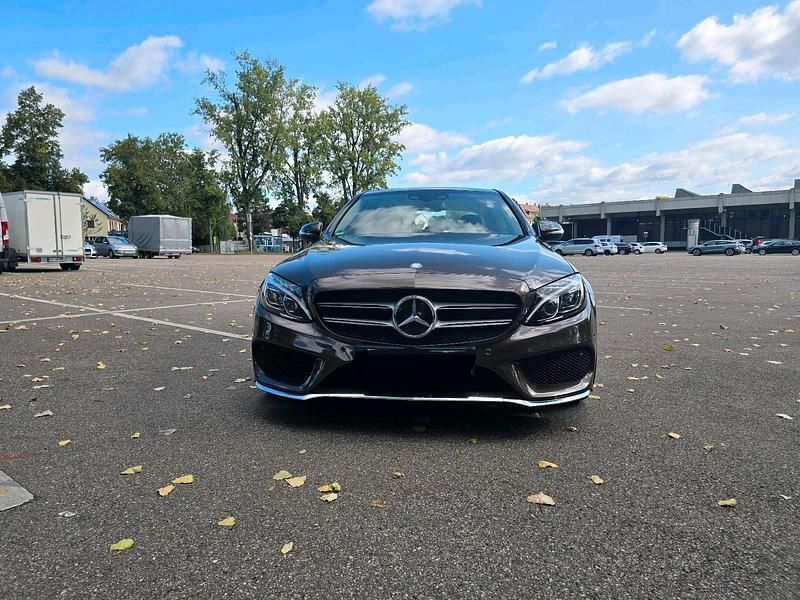 Braun Gebraucht 2014 Mercedes C220 AMG line Limousine | 22.900 € - Bild 1/4