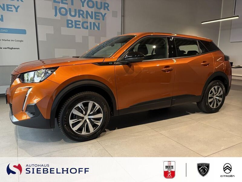 Orange metallic Gebraucht 2023 Peugeot e-2008 Active SUV | 18.450 € (Superpreis) - Bild 1/4