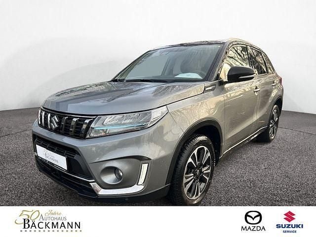 Grau Gebraucht 2021 Suzuki Vitara Comfort+ SUV | 20.950 € (Fairer Preis) - Bild 1/3