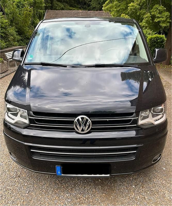Schwarz Gebraucht 2013 VW Multivan Highline Van | 26.700 € (Fairer Preis) - Bild 1/4