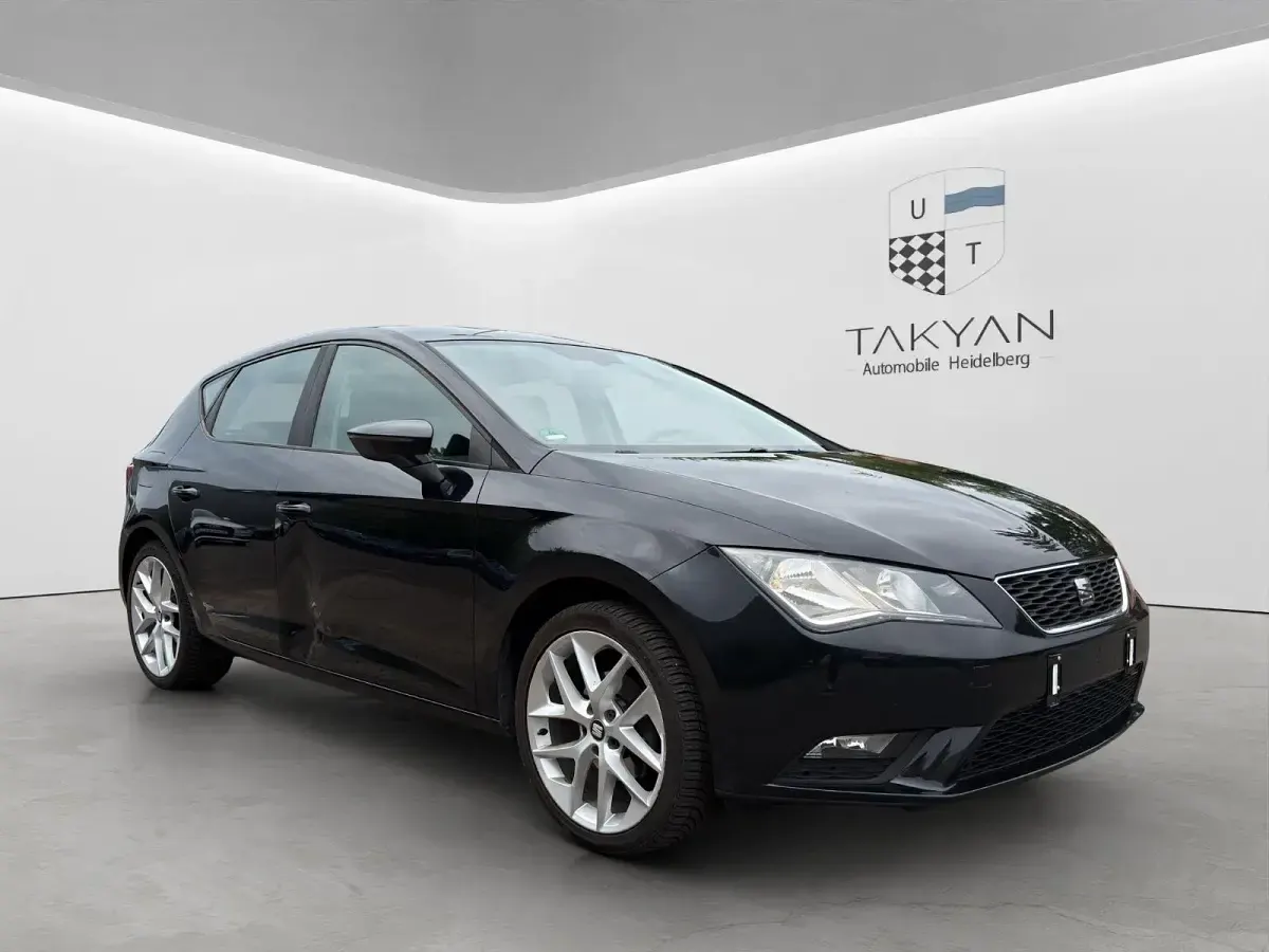 Używany Seat Leon Style 105 KM (77 kW) 2014 Czarny Kombi