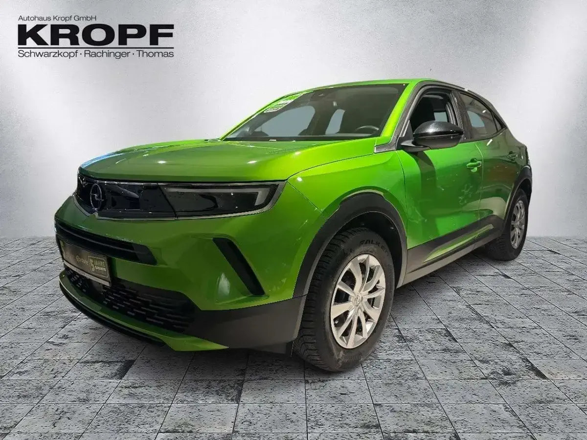 Gebraucht Opel Mokka Enjoy 136 PS (100 kW) 2023 Lackierung matcha green/typ au SUV