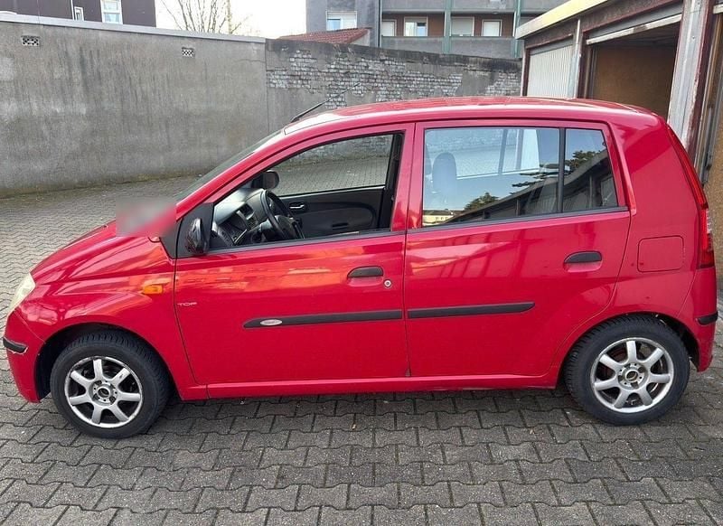 Gebraucht Daihatsu Cuore 58 PS (42 kW) 2003 Rot Kleinwagen