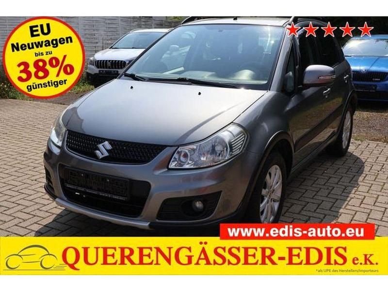 Galacticgrau (metallic) Gebraucht 2013 Suzuki SX4 SUV | 5.900 € (Superpreis) - Bild 1/4
