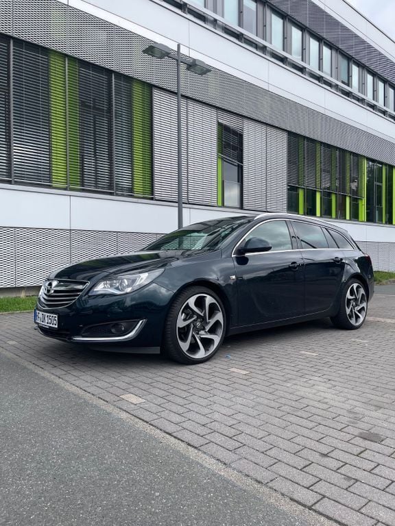 Grün Gebraucht 2014 Opel Insignia Eco Kombi | 15.000 € - Bild 1/4