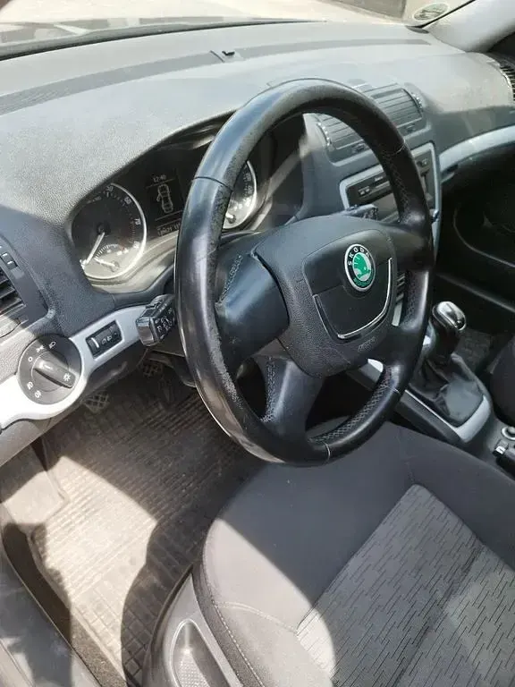 Używany Skoda Octavia Ambiente 122 KM (89 kW) 2011 Czarny Kombi