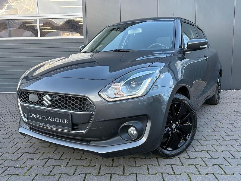 Grau Gebraucht 2019 Suzuki Swift Comfort+ Limousine | 13.500 € (Fairer Preis) - Bild 1/4