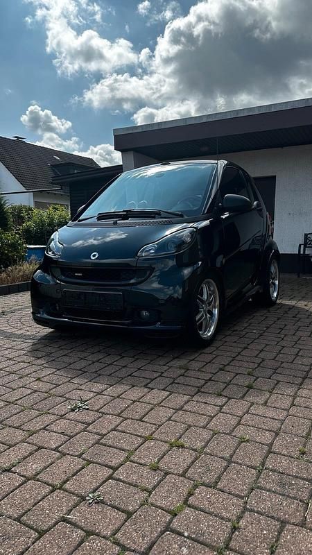Schwarz Gebraucht 2011 Smart ForTwo Cabrio Brabus Xclusive Cabrio | 10.600 € (Fairer Preis) - Bild 1/4