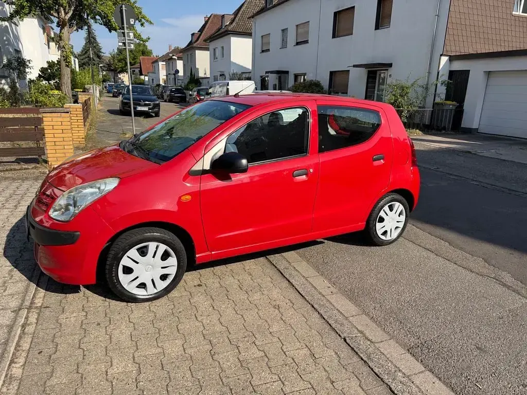 Gebraucht Nissan Pixo Acenta 68 PS (50 kW) 2010 Rot Kleinwagen