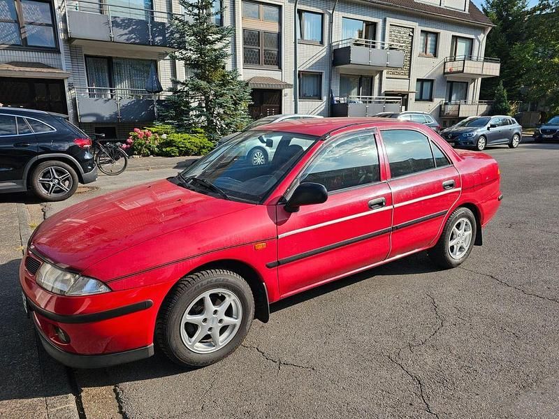 Rot Gebraucht 1999 Mitsubishi Carisma Limousine | 1.400 € (Superpreis) - Bild 1/4
