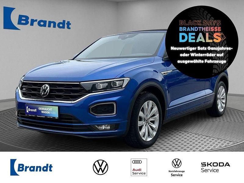 Ravennablau metallic (metallic) Gebraucht 2022 VW T-Roc Cabriolet R-line Cabrio | 26.790 € (Superpreis) - Bild 1/3