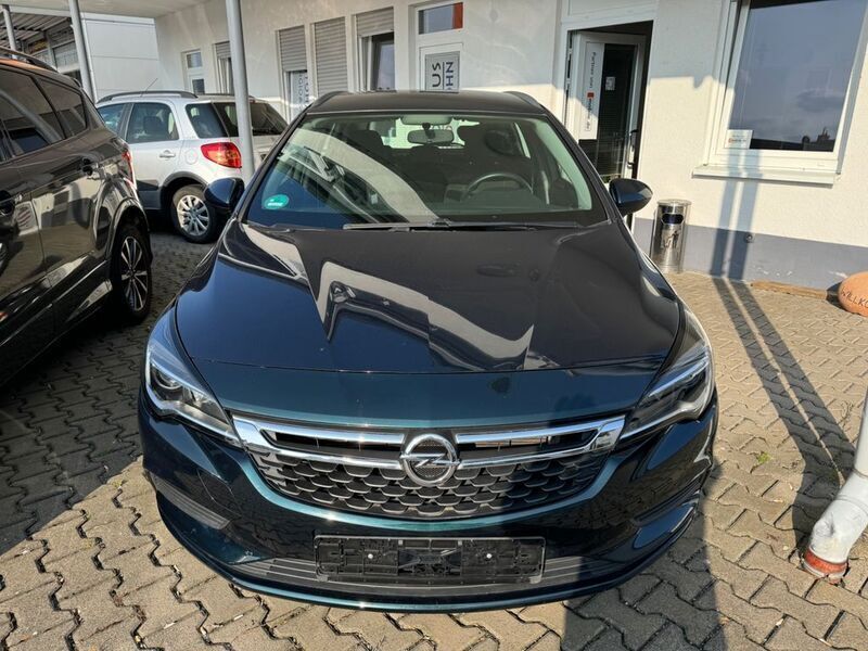 Grün Gebraucht 2016 Opel Astra Edition Kombi | 9.490 € (Superpreis) - Bild 1/4