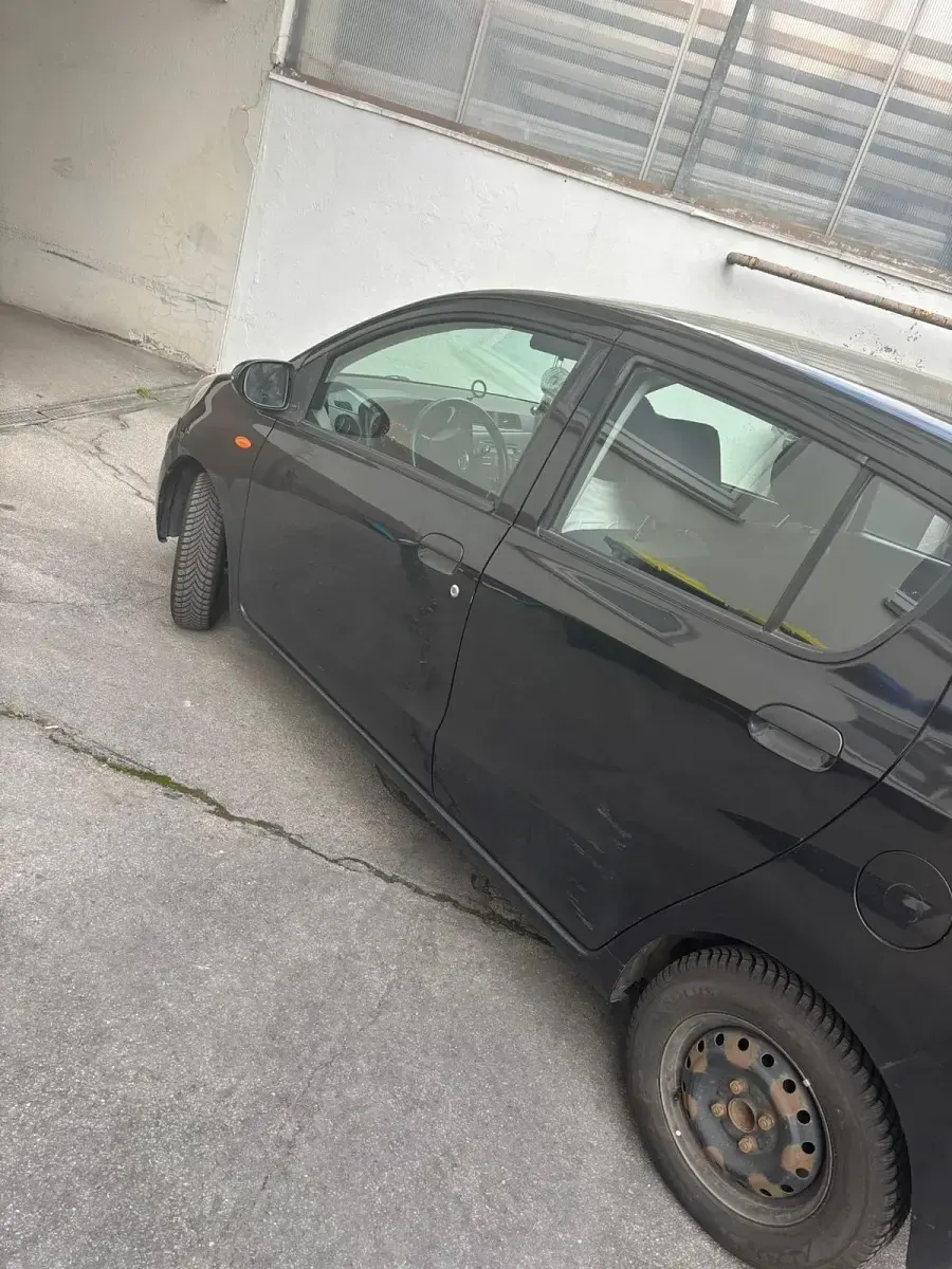 Gebraucht Daihatsu Cuore 70 PS (51 kW) 2009 Schwarz Kleinwagen