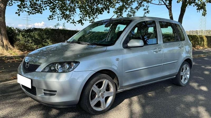 Sternsilber metallic Gebraucht 2006 Mazda 2 Active Van / Kleinbus | 4.200 € (Fairer Preis) - Bild 1/4