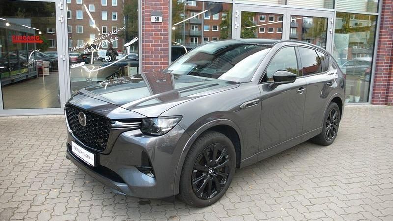 Machine grey Gebraucht 2022 Mazda CX-60 Homura-Line SUV | 36.485 € (Fairer Preis) - Bild 1/4