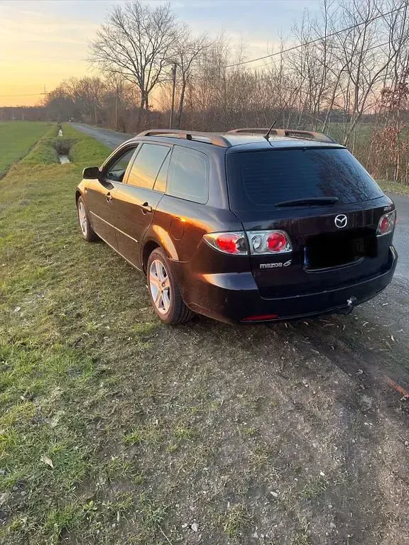 Używany Mazda 6 Exclusive 120 KM (88 kW) 2006 Purpurowy Kombi