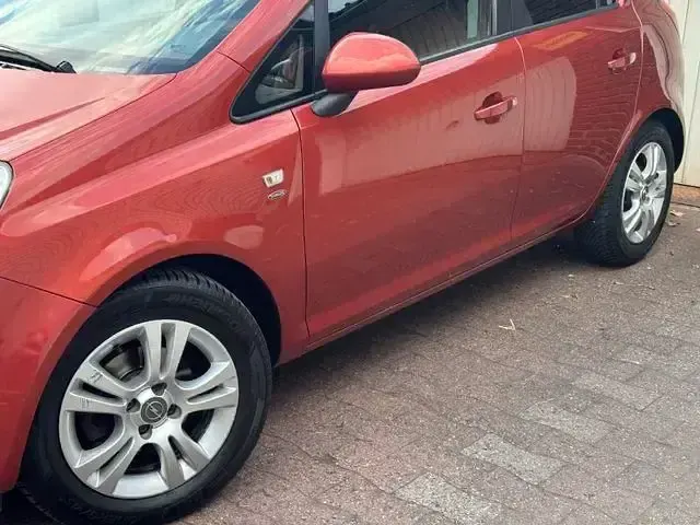 Gebraucht Opel Corsa Satellite 87 PS (63 kW) 2012 Orange Kleinwagen