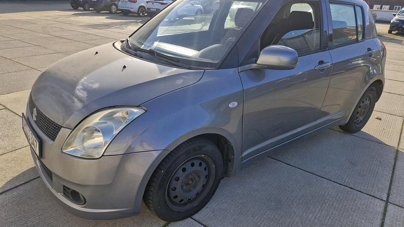 Grau Gebraucht 2007 Suzuki Swift Limousine | 2.200 € (Superpreis) - Bild 1/4