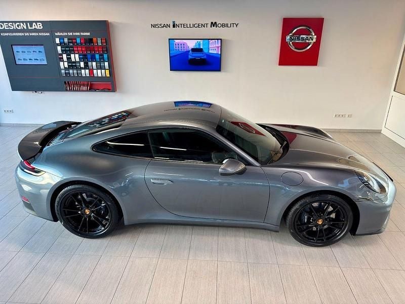Gebraucht Porsche 911 Carrera 394 PS (289 kW) 2024 Vanadiumgrau metallic Coupé