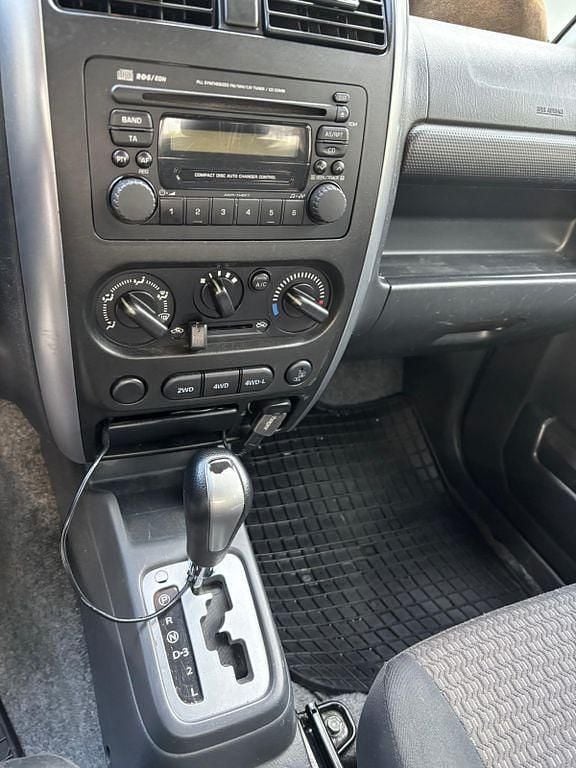 Grün Gebraucht 2011 Suzuki Jimny Comfort SUV | 13.900 € (Fairer Preis) - Bild 1/4