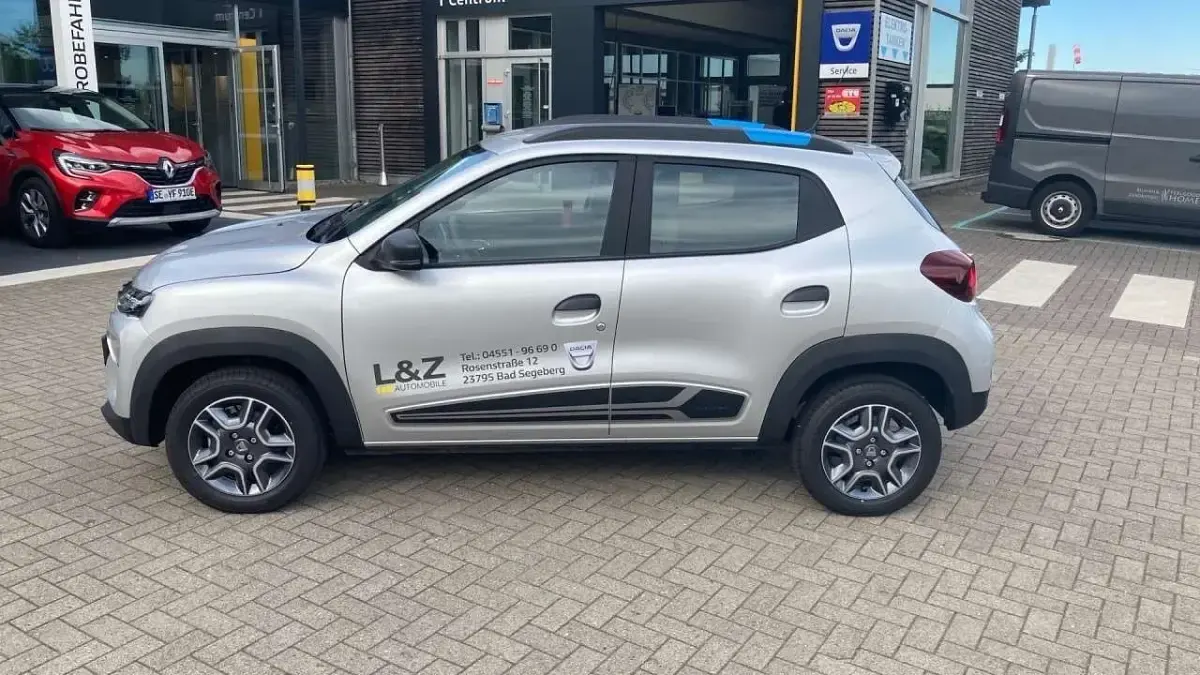 Gebraucht Dacia Spring Comfort 33 kW (45 PS) 2021 Silbergrau metallic Kleinwagen