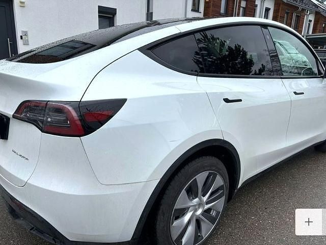 Gebraucht Tesla Model Y Long Range AWD 378 kW (514 PS) 2023 Sonderlackierung perlweiß SUV