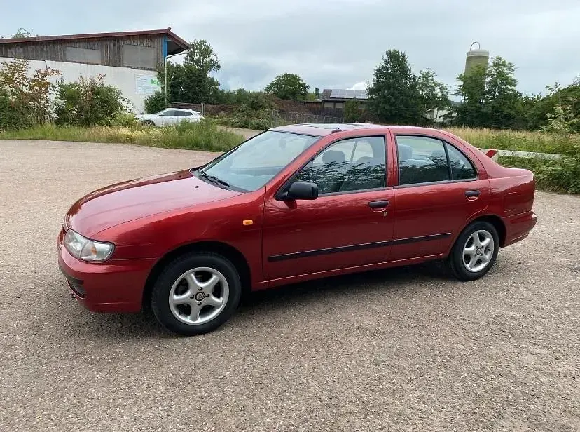 Gebraucht Nissan Almera 75 PS (55 kW) 1997 Rot Kleinwagen