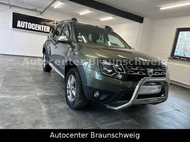 Grün Gebraucht 2015 Dacia Duster Prestige SUV | 8.450 € (Fairer Preis) - Bild 1/4