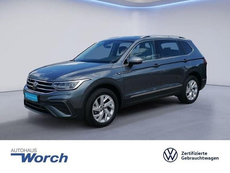 Platinum grey metallic Gebraucht 2024 VW Tiguan Allspace Life SUV | 31.639 € (Superpreis) - Bild 1/3