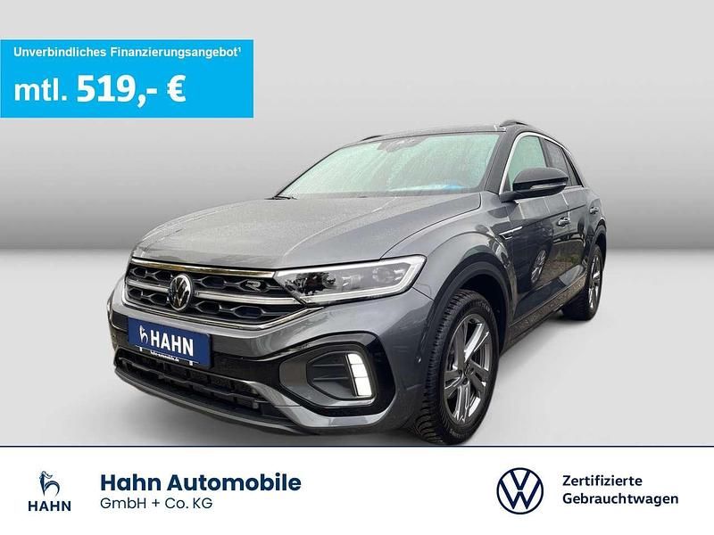 Indiumgrau metallic Gebraucht 2024 VW T-Roc R-line SUV | 33.630 € (Etwas zu teuer) - Bild 1/3