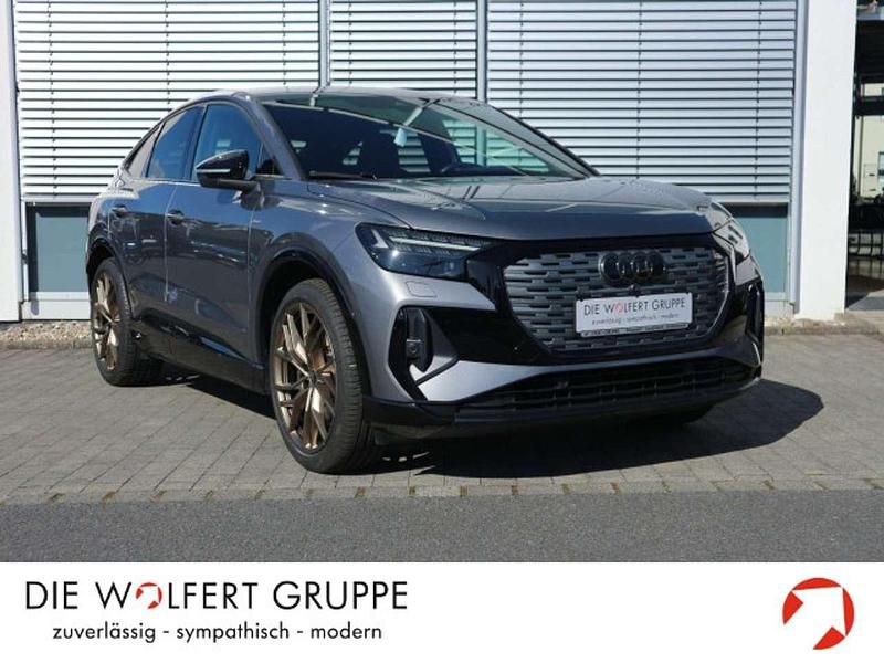 Taifungrau metallic Gebraucht 2022 Audi Q4 Sportback e-tron Sport SUV | 33.780 € (Fairer Preis) - Bild 1/4