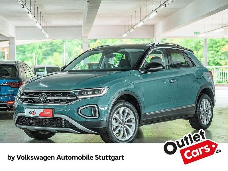 Petroleum blue metallic/schwar Gebraucht 2023 VW T-Roc Style SUV | 25.630 € (Superpreis) - Bild 1/4