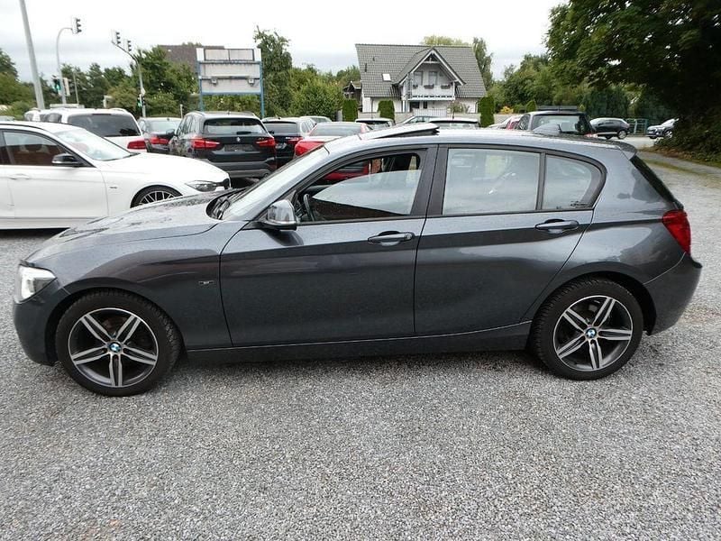 Grau Gebraucht 2012 BMW 116 Sport Line Kleinwagen | 7.499 € (Fairer Preis) - Bild 1/4