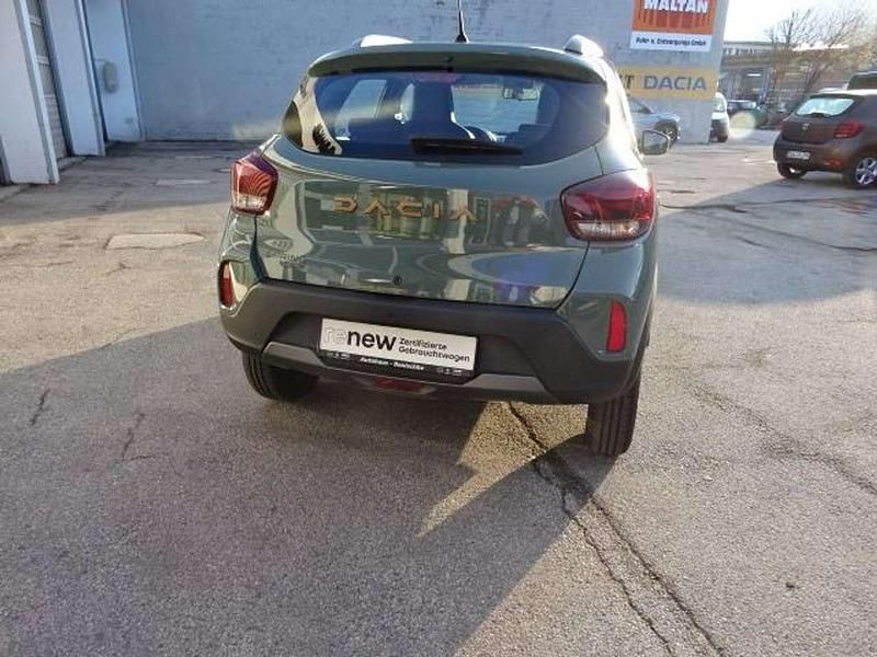 Gebraucht Dacia Spring Extreme 47 kW (65 PS) 2023 Olivgrün Kleinwagen