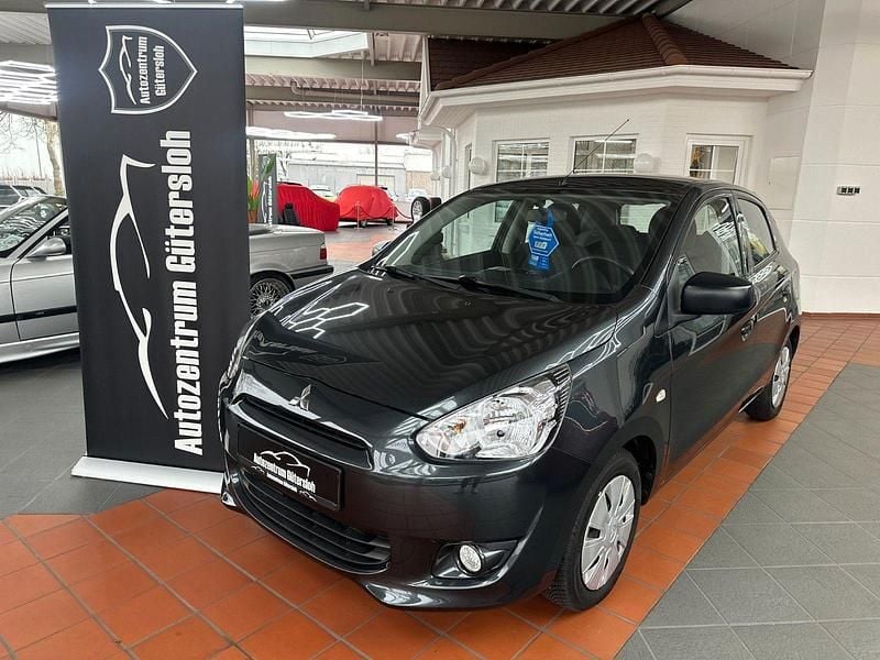 Grau Gebraucht 2013 Mitsubishi Space Star Kleinwagen | 5.499 € (Fairer Preis) - Bild 1/4