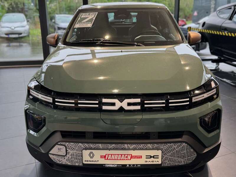 Grün "flechtengrau" Neu 2025 Dacia Spring Extreme Kleinwagen | 18.440 € (Fairer Preis) - Bild 1/4