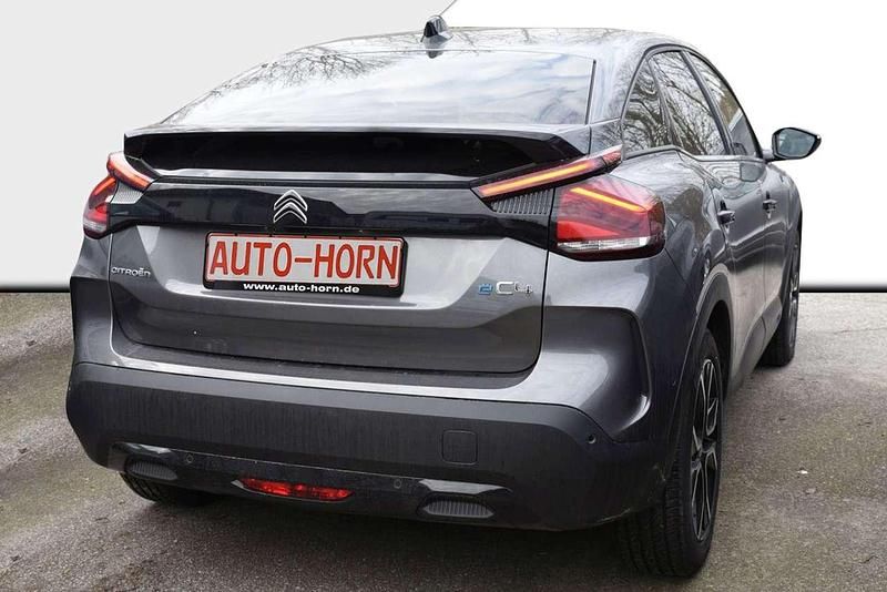 Gebraucht Citroën e-C4 Shine 100 kW (136 PS) 2023 Platinumgrau metallic Limousine