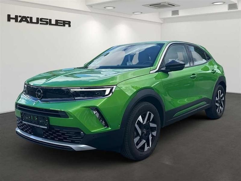 Matcha grün (metallic) Gebraucht 2022 Opel Mokka-e Elegance SUV | 17.890 € (Fairer Preis) - Bild 1/4